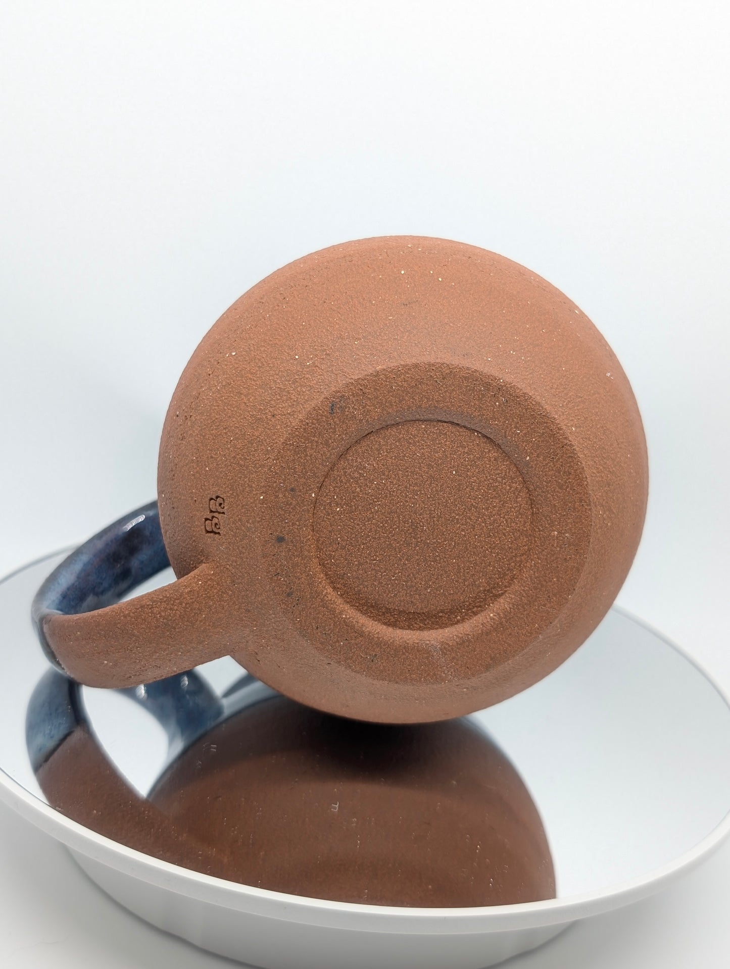 Red clay and blue waves mug