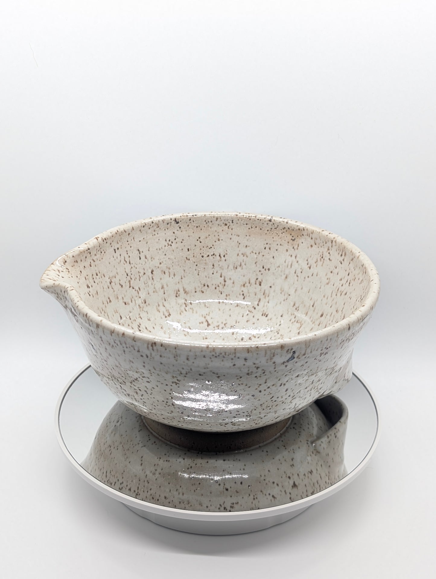 Speckled white mixing bowl with grip