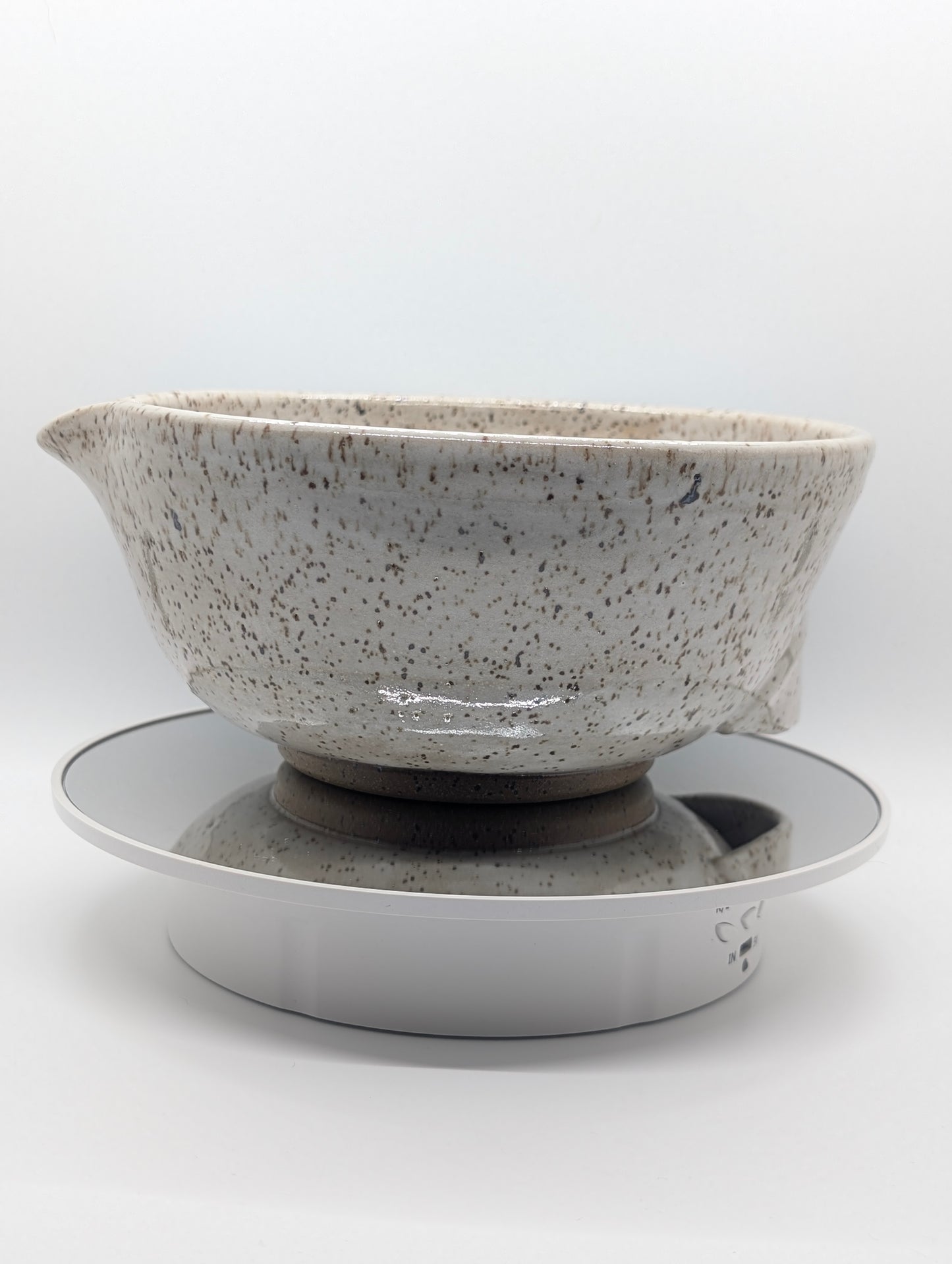 Speckled white mixing bowl with grip